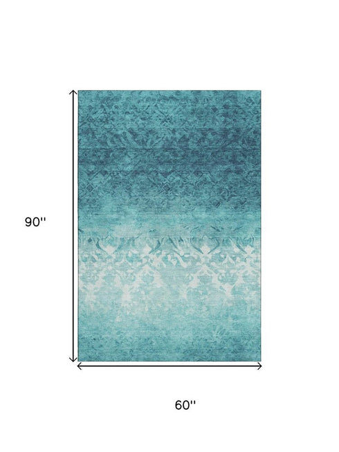 5' X 8' Teal And Ivory Damask Washable Area Rug With UV Protection