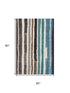 5' X 8' Brown Teal And Ivory Striped Washable Area Rug With UV Protection