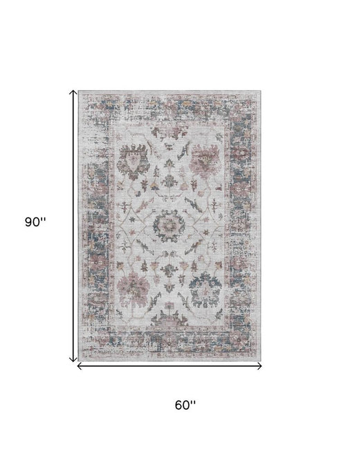 5' X 8' Blush Ivory And Denim Blue Oriental Washable Area Rug With UV Protection
