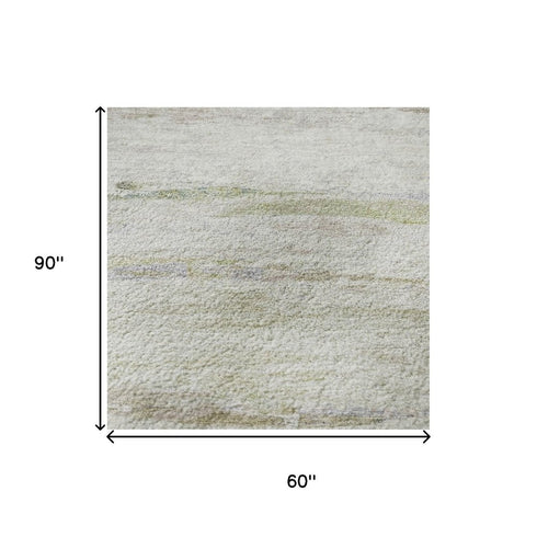 5' X 8' Ivory And Beige Abstract Washable Area Rug With UV Protection