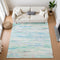 8' X 10' Teal And Ivory Abstract Washable Area Rug With UV Protection