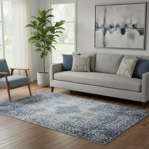 5' X 8' Denim Blue Gray And Ivory Abstract Washable Area Rug With UV Protection