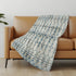 50" X 70" Ivory And Teal Geometric Microfiber Plush Throw Blanket