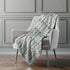 50" X 70" Ivory And Teal Geometric Microfiber Plush Throw Blanket