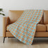 50" X 70" Orange Ivory And Teal Geometric Microfiber Plush Throw Blanket