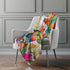 50" X 70" Orange Pink And Blue Animal Print Polyester Woven Plush Throw Blanket