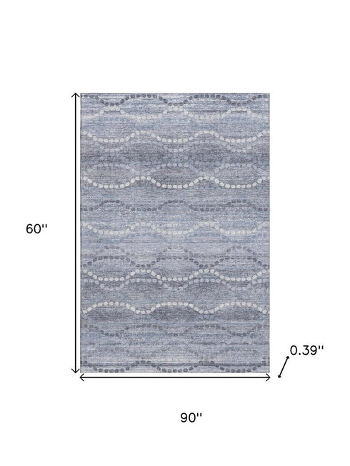 5' X 8' Blue And Ivory Abstract Geometric Washable Area Rug With UV Protection