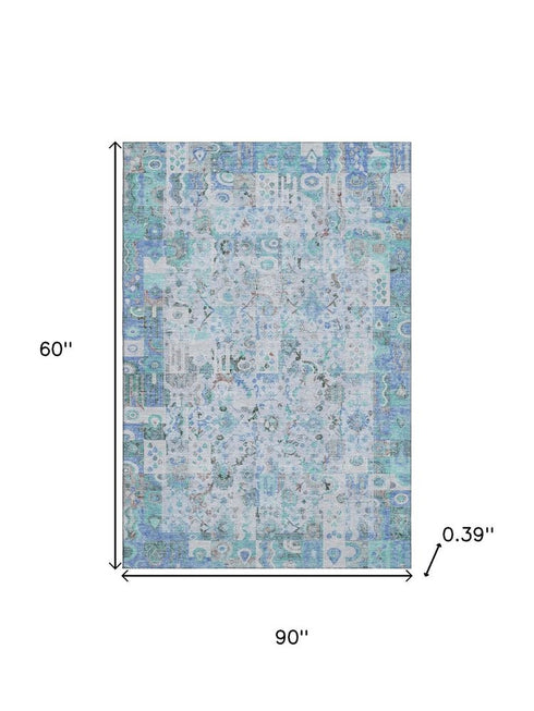 5' X 8' Blue And Ivory Patchwork Washable Area Rug With UV Protection
