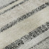 5' X 8' Black And Beige Striped Washable Area Rug With UV Protection