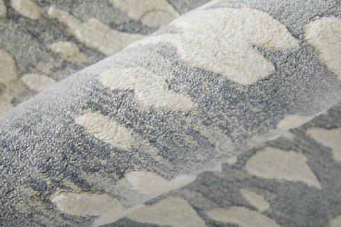 5' X 8' Blue And Ivory Abstract Hand Woven Area Rug