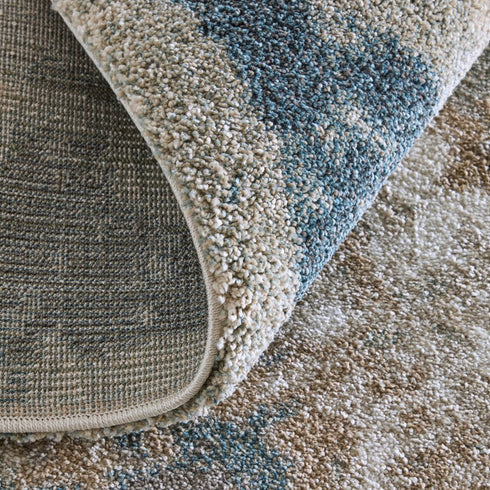 9' X 12' Blue And Ivory Abstract Area Rug