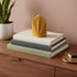 6" Gold Mahogany And Teakwood Scented Dimensional Palm Leaf Candle