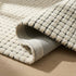 8' Beige And Black Checkered Area Rug