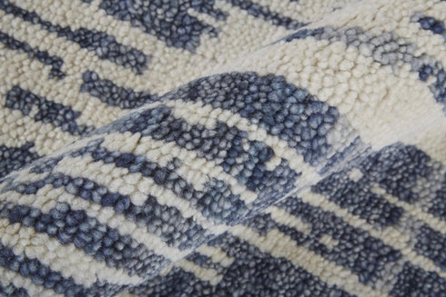 5' X 8' Ivory And Blue Wool Abstract Hand Knotted Area Rug With Fringe