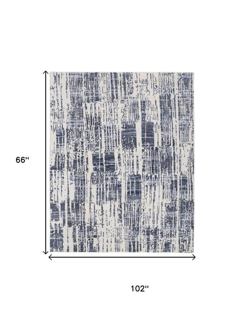 5' X 8' Ivory And Blue Wool Abstract Hand Knotted Area Rug With Fringe