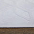 7' White And Gray Geometric Round Rug