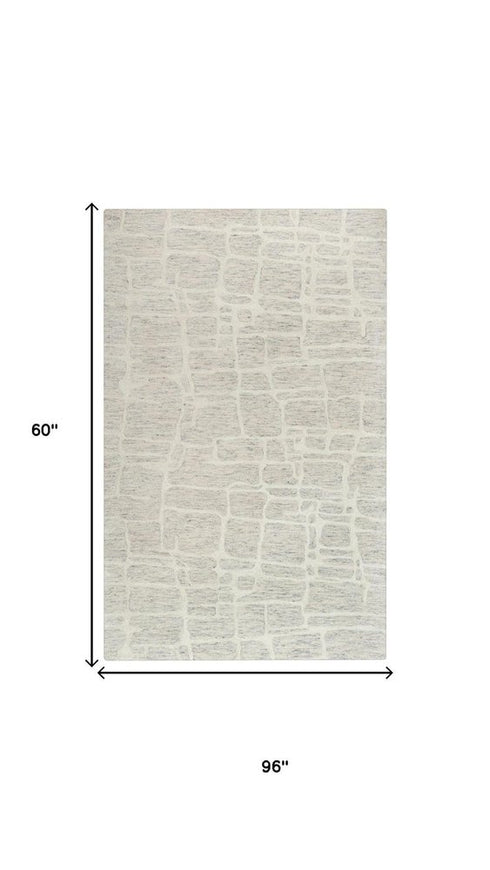 5' X 8' Ivory And Beige Wool Abstract Hand Tufted Area Rug
