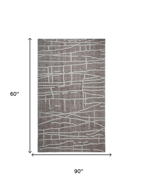 5' X 8' Tan And Ivory Wool Abstract Hand Tufted Area Rug