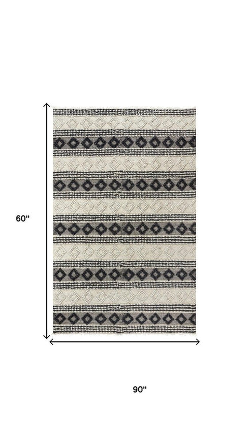 5' X 8' Beige Navy Blue And Blue Wool Geometric Hand Woven Area Rug