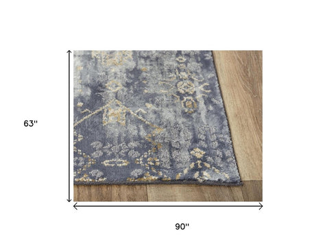 5' X 8' Gold Charcoal And Ivory Abstract Area Rug