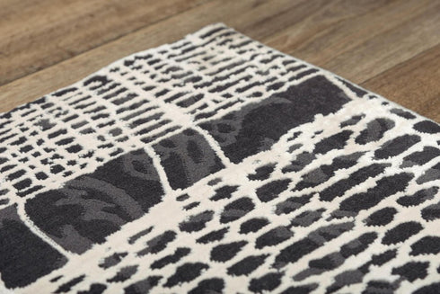 5' X 8' Beige Black Ivory And Gray Abstract Area Rug
