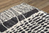 5' X 8' Beige Black Ivory And Gray Abstract Area Rug