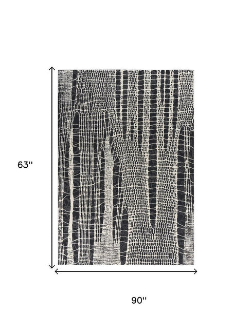 5' X 8' Beige Black Ivory And Gray Abstract Area Rug