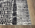 9' X 12' Beige Black Ivory And Gray Abstract Area Rug