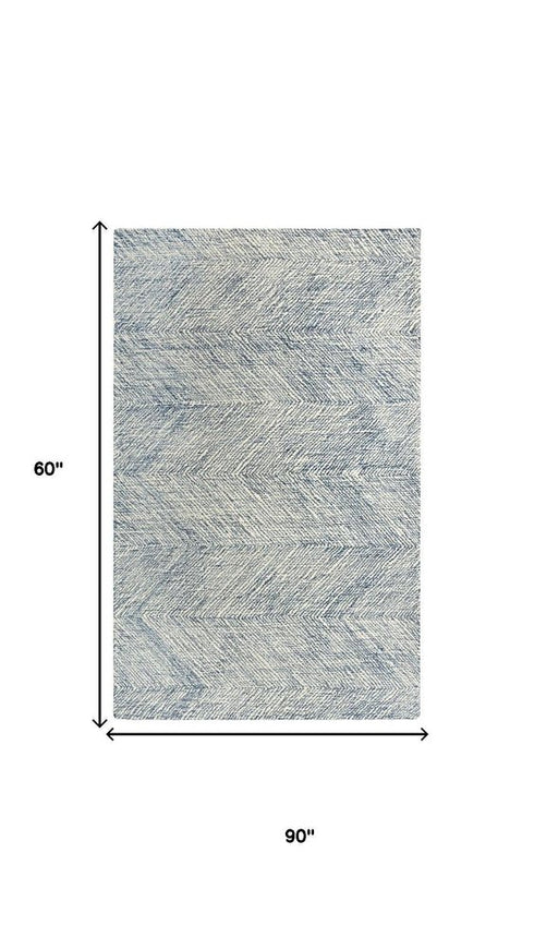 5' X 8' Navy Blue And Ivory Wool Chevron Hand Tufted Area Rug
