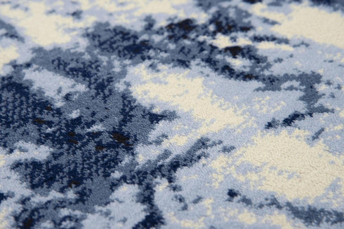5' X 8' Blue And Ivory Abstract Area Rug