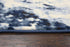 5' X 8' Blue And Ivory Abstract Area Rug