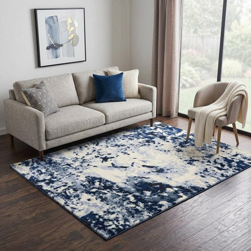 5' X 8' Blue And Ivory Abstract Area Rug