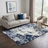 5' X 8' Blue And Ivory Abstract Area Rug