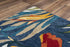 8' X 10' Dark Blue Red Orange Yellow And Green Floral Hand Tufted Area Rug