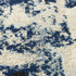 8' X 10' Blue Black Beige And Ivory Abstract Area Rug