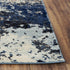 8' X 10' Blue Black Beige And Ivory Abstract Area Rug
