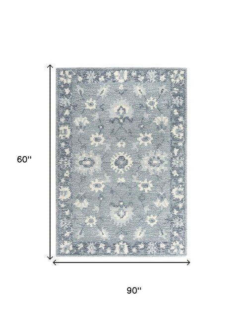 5' X 8' Blue Dark Blue And Ivory Wool Oriental Hand Tufted Area Rug