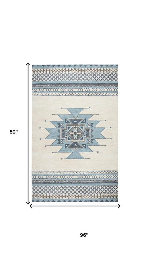 5' X 8' Blue And Ivory Wool Tribal Hand Tufted Area Rug