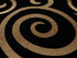 Black, Beige, and Gold Circle Swirls Abstract Area Rug