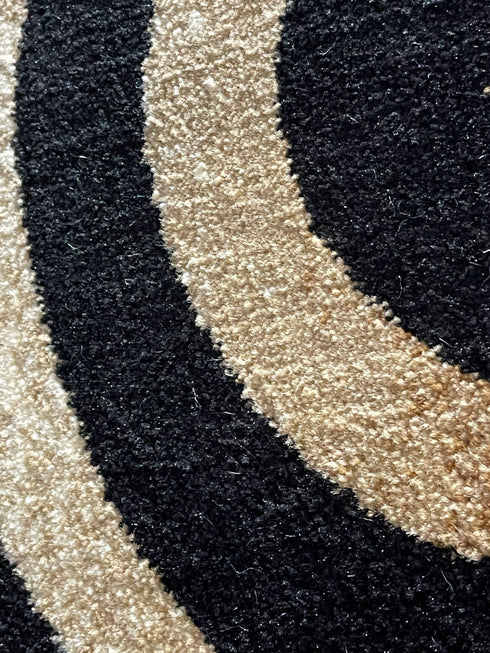 Black, Beige, and Gold Circle Swirls Abstract Area Rug