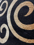 Black, Beige, and Gold Circle Swirls Abstract Area Rug